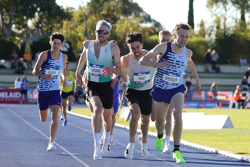 Adam Spencer overtakes a group of runners to win