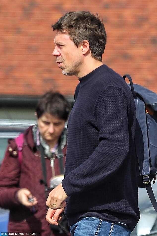 The Crown actor wore a simple navy jumper and jeans as the family ran errands.