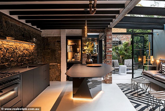 Buyers splashed out on major renovations, the Herald Sun reported on Saturday, after Tina herself made some improvements.  In the photo: the extraordinary kitchen and living room.