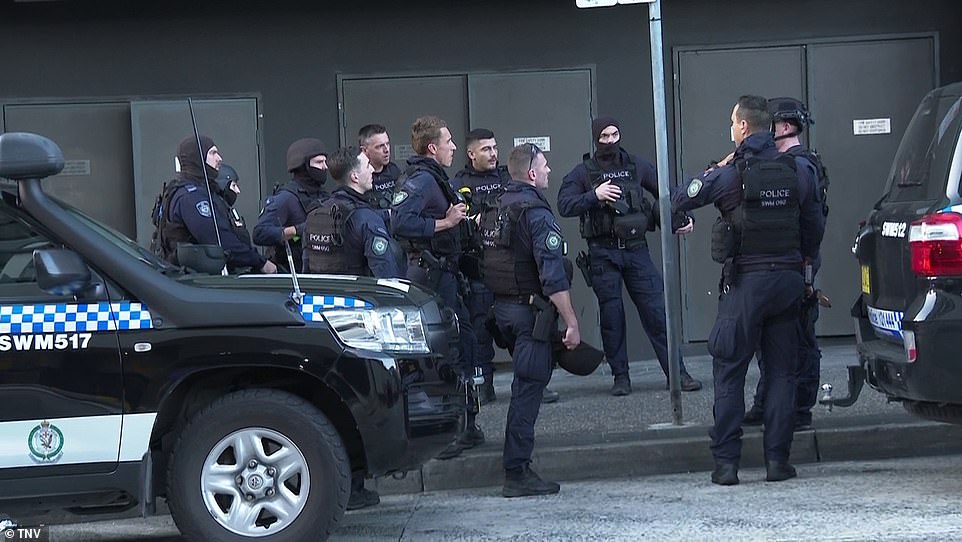 Tactical police prepare to assault the shopping center