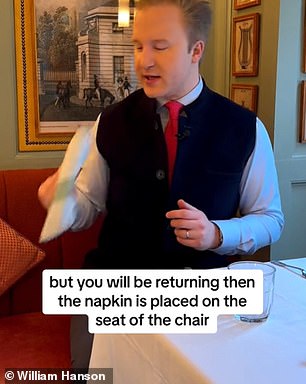 In the video, the Merlin of good manners explains that the napkin when you get up from the table and plan to return - let's say to go to the bathroom - is placed on your seat, or on the arm of the chair if it has one.