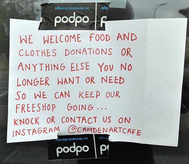 The squatters have put up a sign asking for donations to keep what they describe as a 'freeshop' going.