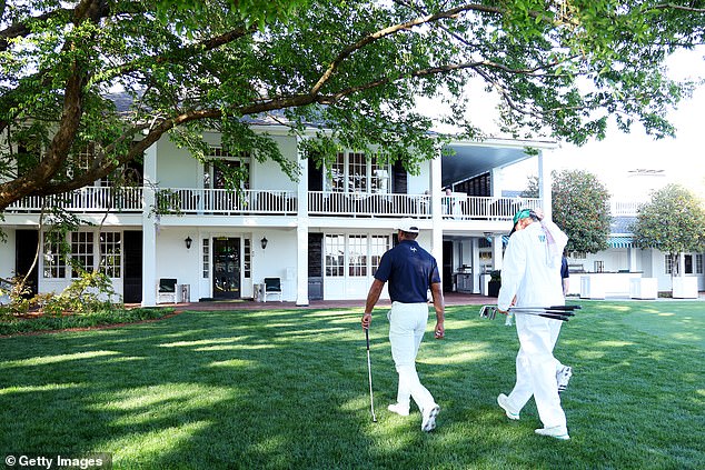 Augusta National clubhouse has one door open and one closed at the same time