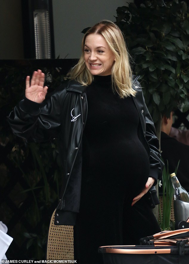 Former dancer Sophie showed off her effortless sense of style in a black leather jacket as she cradled her baby bump.