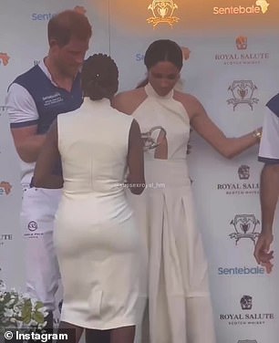 The move caused some awkward shuffling on stage as Meghan insisted on standing next to her husband.