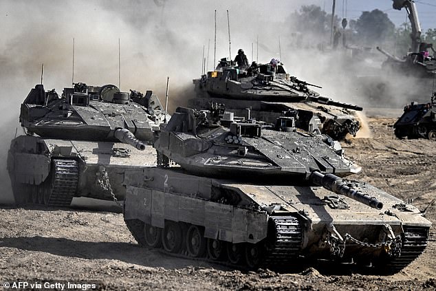 Israeli army battle tanks move in an area along the border with the Gaza Strip and southern Israel on April 2, 2024.
