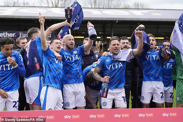 League Two leaders Stockport were also promoted after beating Morecambe 2-0.