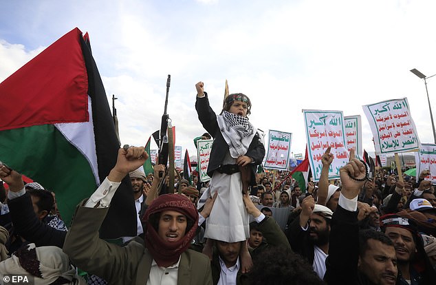 Houthi supporters shout slogans during a demonstration marking Al-Quds Day, in Sana'a, Yemen