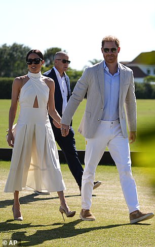 Meghan took a risk in sky-high heels on the grassy field on Friday