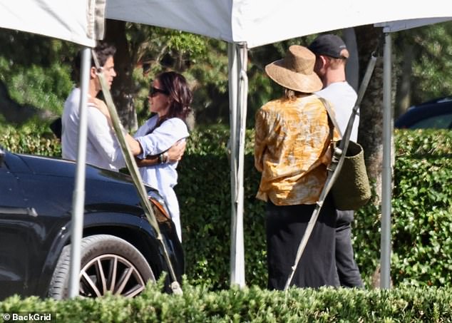 Meghan was seen hugging Nacho Figueras as she joined her husband Prince Harry's photo shoot.