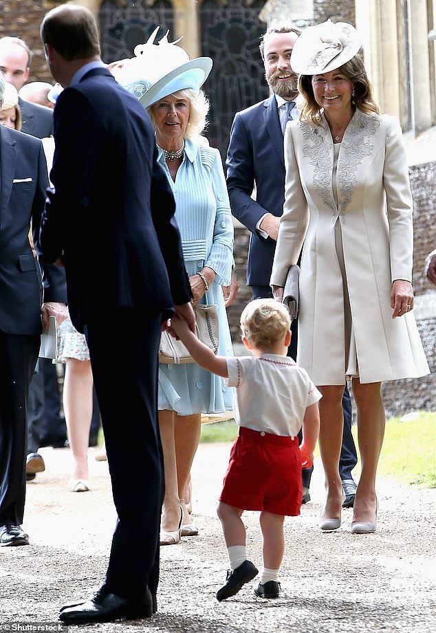 Carole, right, smiles at Prince George as they attend Princess Charlotte's christening in 2015.