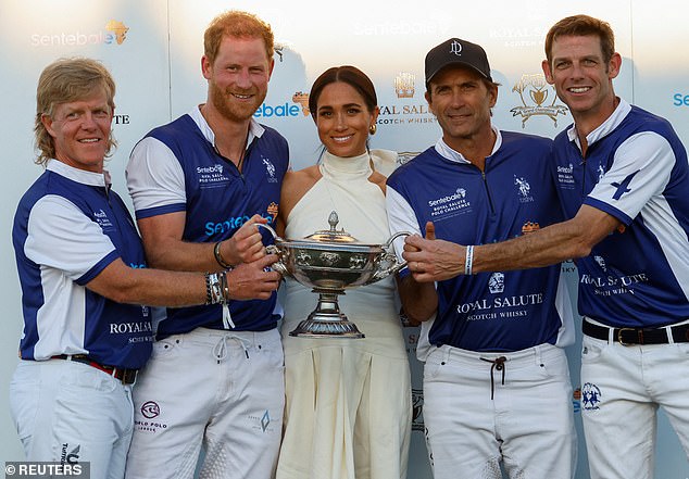 Meghan joined her husband's team as they celebrated their victory.