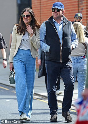 Johnson, who was joined by her boyfriend, turned heads in a stylish cropped wool jacket and high-waisted summer pants as they toured a host of boutiques.