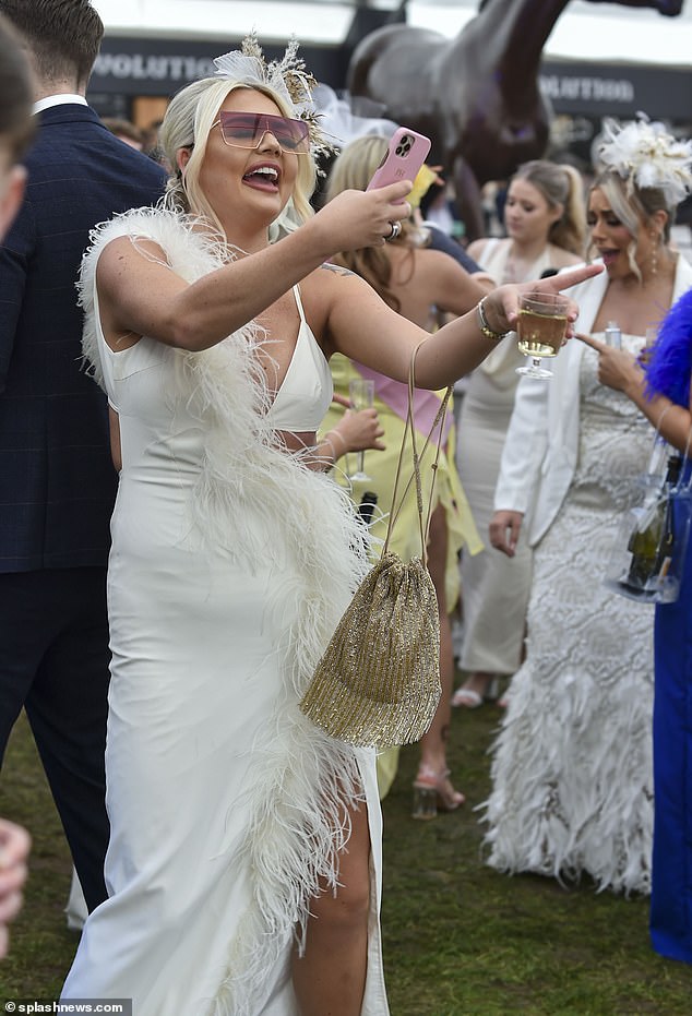 One reveler cut a chic figure in a cut-out white ensemble as she danced the afternoon away.