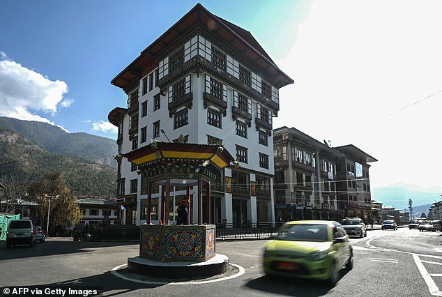 In this photo taken on January 10, 2024, a traffic policeman directs traffic in Thimphu, the capital of Bhutan.