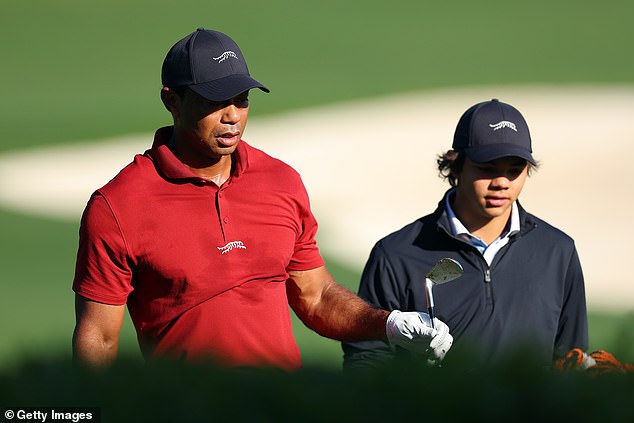 Tiger and Charlie Woods are seen in the warm-up area at Augusta wearing dad's clothing line.