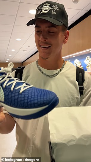 Dodgers pitcher Bobby Miller admires his new Nike Kobe 6 cleats LA Dodgers PE