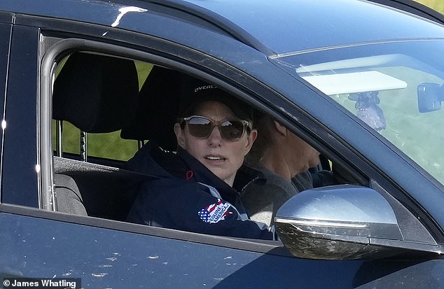 The mother-of-three sported stylish sunglasses and a cap as she was in the car this afternoon.