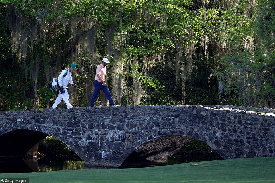 Scheffler crosses Nelson Bridge on the 13th hole during the final round of the Masters