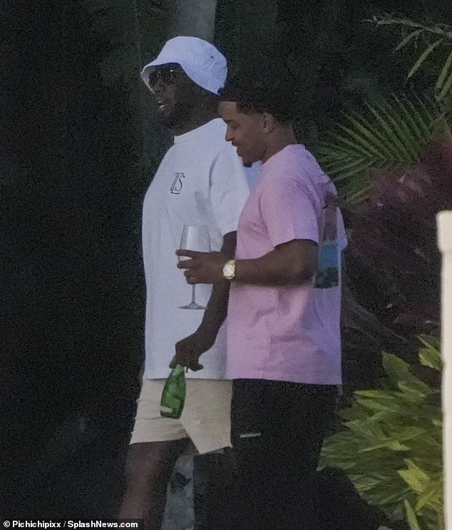 The Grammy winner, 54, enjoyed a leisurely stroll through his exclusive Star Island community with Dior, 30.
