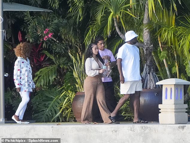 They were joined by Justin's girlfriend, Stephanie Rao, as Justin and Stephanie enjoyed a glass of wine during the outing.