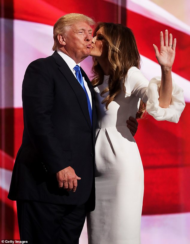 Melania kisses Trump after giving a speech on the first day of the Republican National Convention on July 18, 2016.