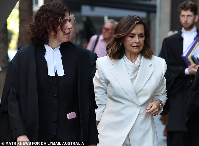 Lisa Wilkinson arrived at court to receive the verdict this morning dressed all in white.