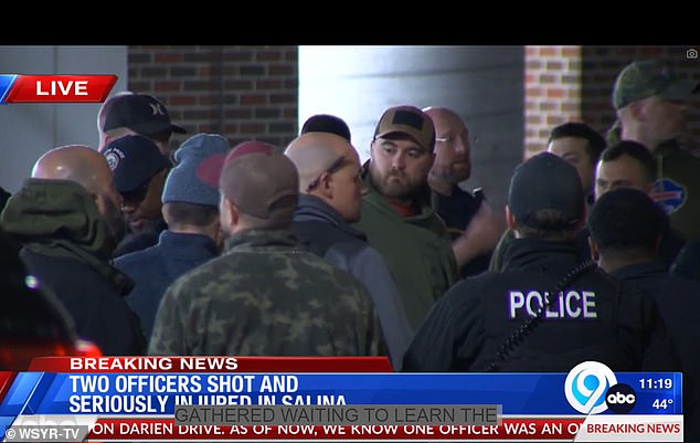 Large numbers of police officers from across central New York gathered outside Upstate University Hospital, where the officers had been taken.