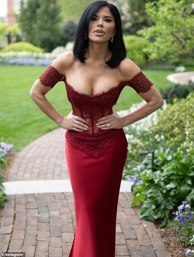 She nearly fell out of her figure-hugging lace corset dress while posing in a garden before the White House state dinner.