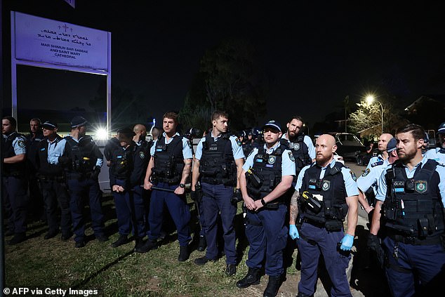 A congregation of police officers gather outside the church in Wakeley, Sydney.