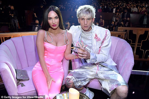 Megan and MGK met in 2020 and got engaged in 2022. Announcing their engagement, Megan said she and MGK 'drank each other's blood' to celebrate;  seen in 2021