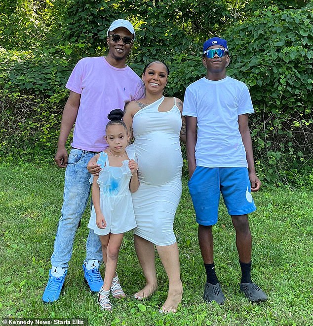 Mrs Ellis with her family while pregnant with her third child