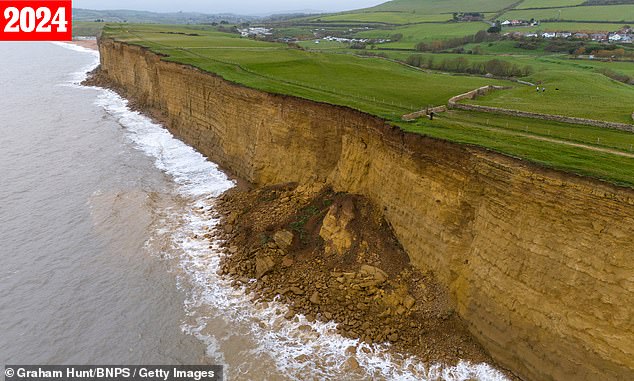 Pictured in 2024: The cliffs at nearby Burton Bradstock have been seen crumbling further towards the sea over time.