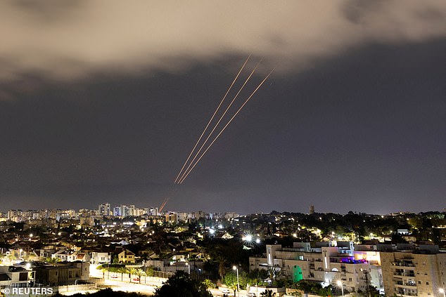 An anti-missile system operates after Iran launched drones and missiles towards Israel, as seen from Ashkelon, Israel, on April 14, 2024.