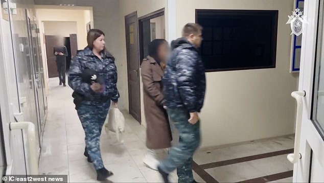 Guards take Mironova out of the courtroom