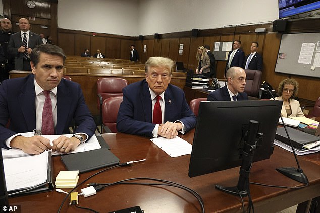 Trump with his legal team, from left: Todd Blanche, Emil Bove and Susan Necheles