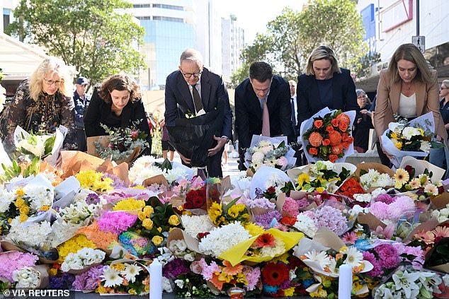 Australian Prime Minister Anthony Albanese and New South Wales Premier Chris Minns lay flowers at the site of Saturday's mass stabbing in Bondi Junction.