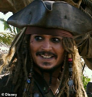 Johnny is known for transforming his smile depending on the roles he plays.  For Pirates of the Caribbean he had an extensive layer of gold on his teeth.
