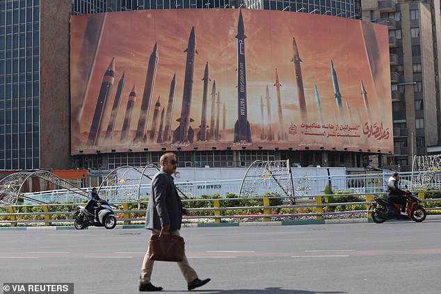 An anti-Israel billboard with an image of Iranian missiles is seen on a street in Tehran, Iran, April 15, 2024.