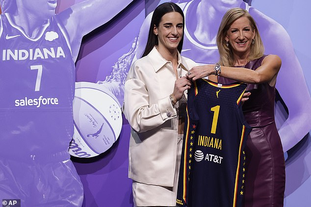 Iowa's Caitlin Clark, left, poses for a photo with WNBA Commissioner Cathy Engelbert.
