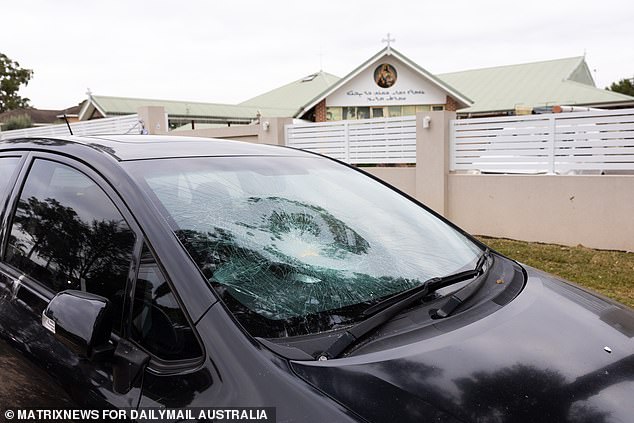 Police and local residents' cars were vandalized in the melee outside the church on Monday night, and the extent of the damage became clear on Tuesday morning.