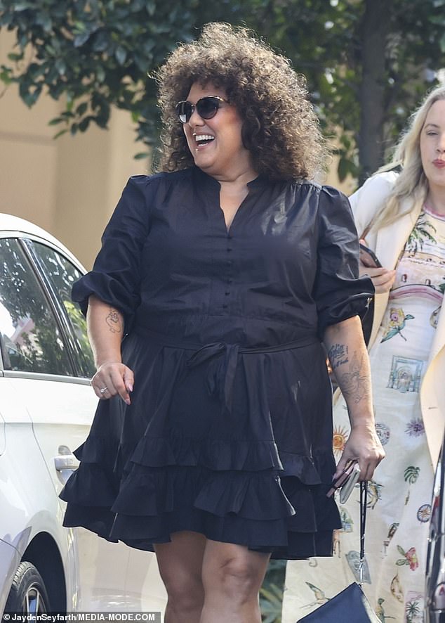 The former Australian Idol star, 35, who won the second season of the singing competition, wore a cute ruffled mini dress from Forever New and paired it with a pair of chunky black heels.