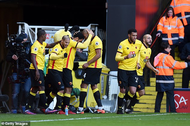 Deeney (third from left) played almost 400 games for Watford and scored 47 goals in the Premier League.
