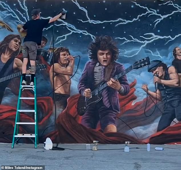 One of the owners of Club 5 Bar claims that Jenner, 28,'s team ruined her AC/DC mural (pictured) by slapping an 818 sticker directly on it during a pop-up event last week, leaving it cracked and peeling .