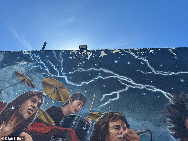 Large chips can be seen on the top of the mural.
