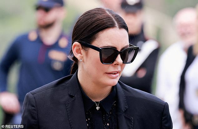 Sandra (pictured at Roberto's funeral in Florence) shares a young son with the designer.