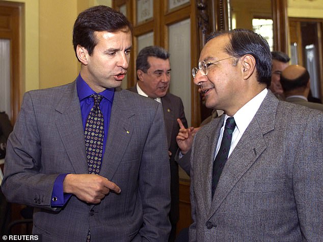 Bolivia's interim president, Jorge Quiroga (L), talks with Manuel Rocha, US ambassador at the vice presidential office in La Paz, July 11, 2001.