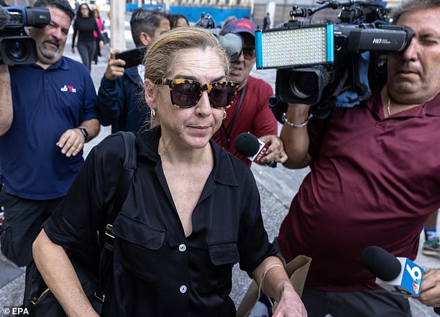 Bill Clinton's diplomat appointee, a father of two, was living outdoors in Florida with his wife, graphic designer Karla Wittkop Rocha, seen here, when he was charged.