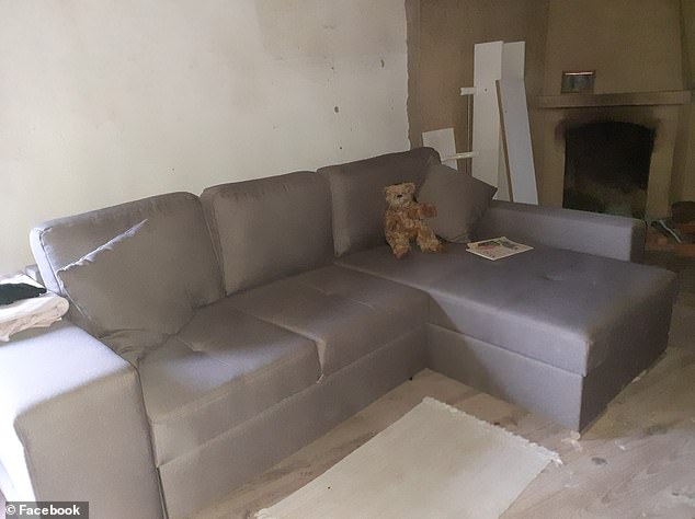 A teddy bear sits on the sofa in the living room of the house, from which the family has been expelled due to alleged resentment from the locals.