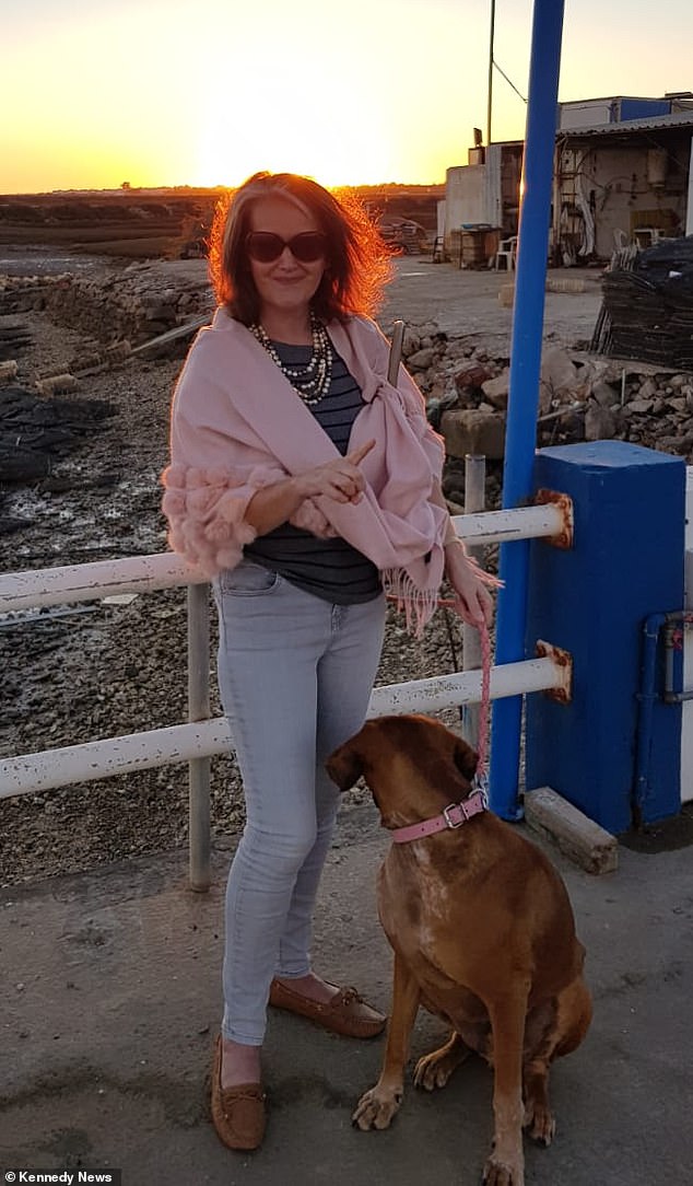 Orla Dargan in Portugal with her rescue dog Henry, who she says was 